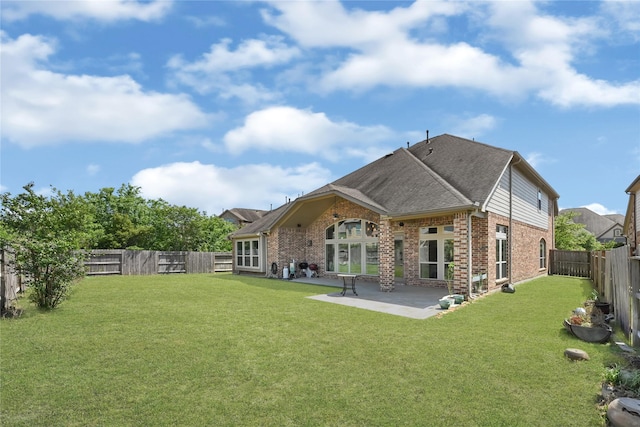 18914 Trinity Star Dr, Cypress, TX 77433 - rear view of property with brick siding, a patio area, and roof with shingles