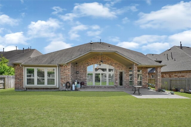 18914 Trinity Star Dr, Cypress, TX 77433 - rear view of property featuring a patio area, brick siding, and roof with shingles