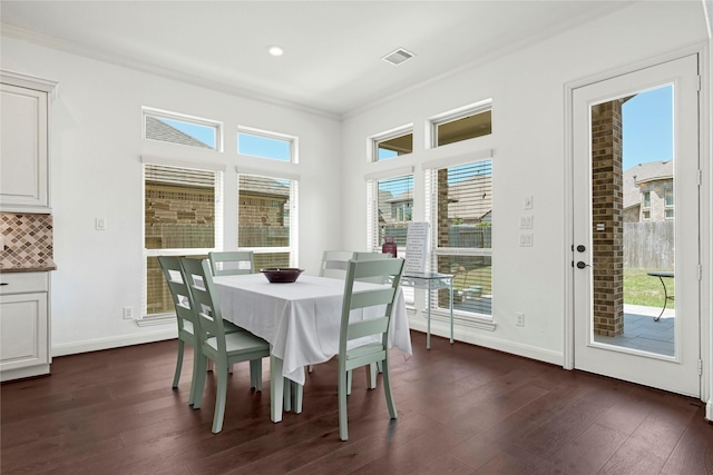 18914 Trinity Star Dr, Cypress, TX 77433 - dining room with dark wood-style flooring, crown molding, and baseboards