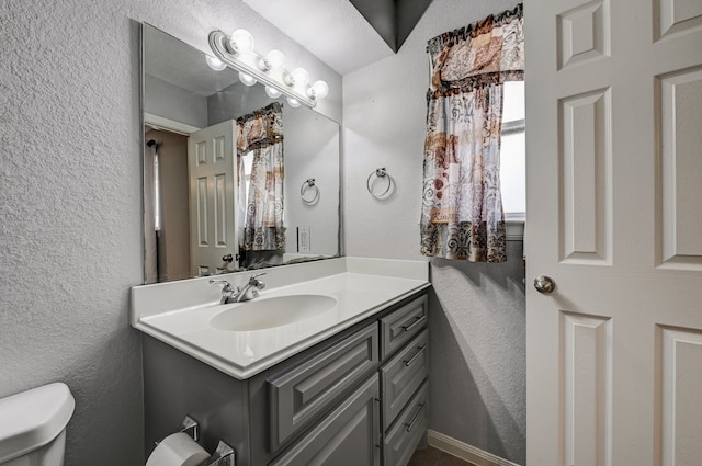 2001 Willow Wisp Dr, Seabrook, TX 77586 - bathroom with toilet, vanity, and a textured wall