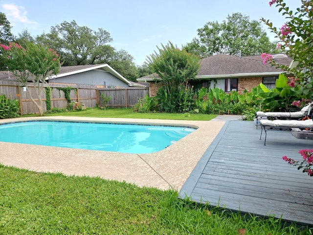 2001 Willow Wisp Dr, Seabrook, TX 77586 - view of swimming pool featuring a fenced backyard and a wooden deck