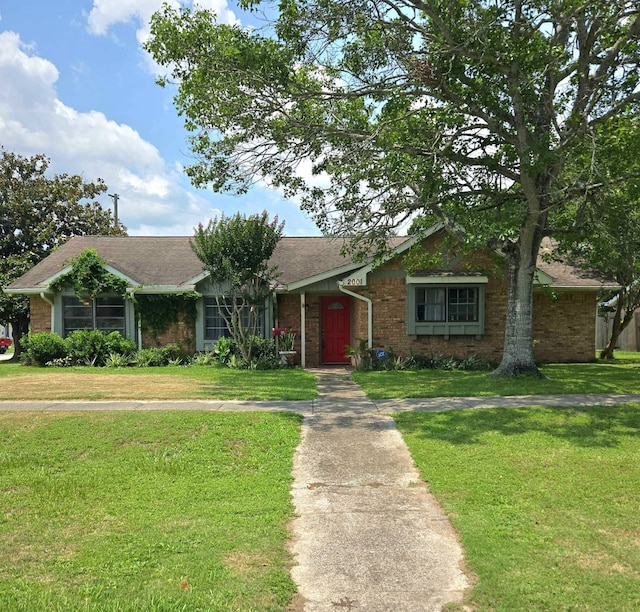 2001 Willow Wisp Dr, Seabrook, TX 77586 - ranch-style house with a front lawn and brick siding