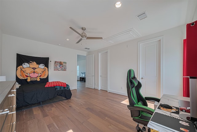 2414 W Kolbe Ln, Houston, TX 77080 - bedroom with attic access, wood finished floors, an office area, recessed lighting, and ceiling fan