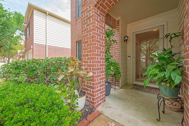 10406 Nickel Grove Dr, Houston, TX 77095 - view of exterior entry featuring brick siding