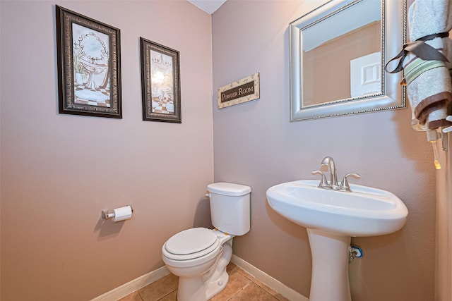 10406 Nickel Grove Dr, Houston, TX 77095 - bathroom with tile patterned floors, toilet, and baseboards