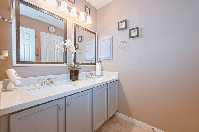 10406 Nickel Grove Dr, Houston, TX 77095 - bathroom with double vanity, baseboards, and tile patterned flooring