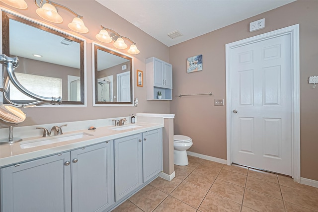 10406 Nickel Grove Dr, Houston, TX 77095 - full bath featuring tile patterned flooring, double vanity, baseboards, and toilet