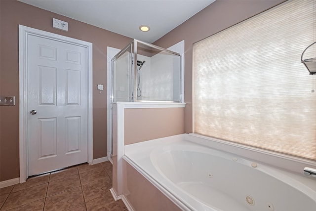 10406 Nickel Grove Dr, Houston, TX 77095 - full bathroom featuring tile patterned flooring, a shower stall, a tub with jets, and baseboards