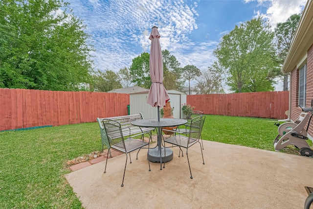 10406 Nickel Grove Dr, Houston, TX 77095 - view of patio with a storage unit, outdoor dining area, and an outbuilding