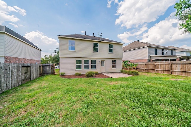 20410 Fall Foliage Dr, Humble, TX 77338 - rear view of house featuring a lawn, a patio, and a fenced backyard