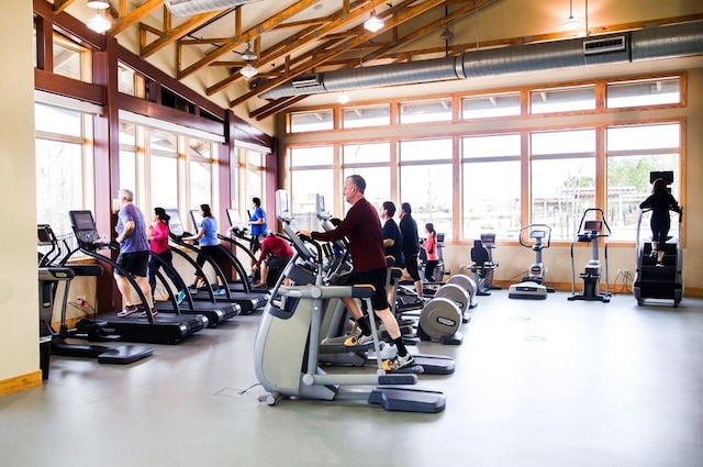 gym with a towering ceiling