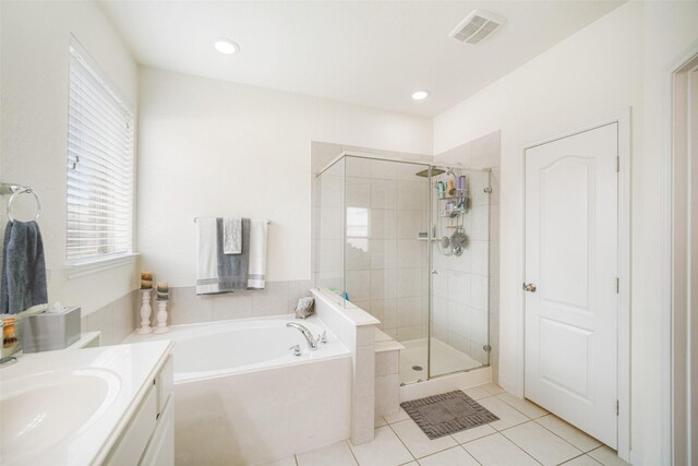 full bath with plenty of natural light, tile patterned floors, a bath, a stall shower, and recessed lighting