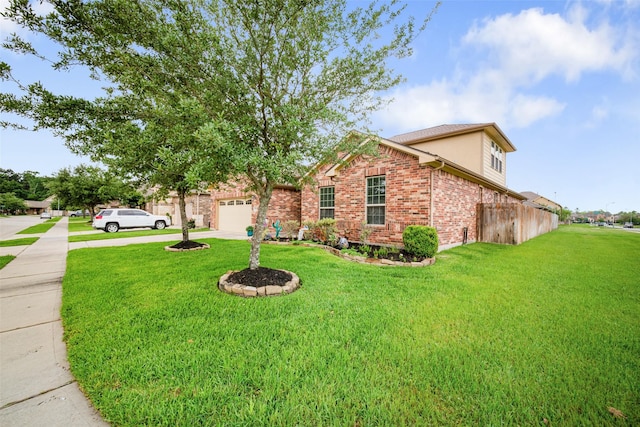 view of front facade with driveway, an attached garage, brick siding, and a front lawn