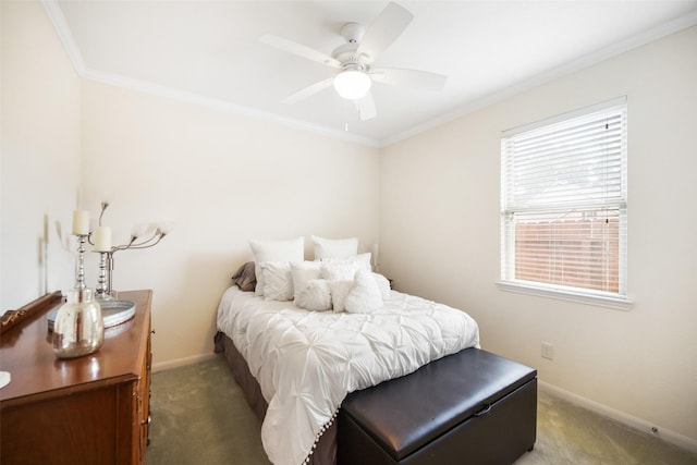 carpeted bedroom with crown molding, baseboards, and a ceiling fan