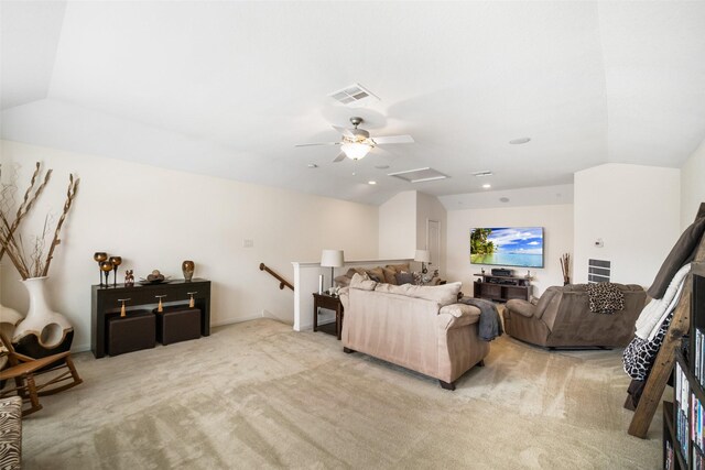 living area with light carpet, attic access, vaulted ceiling, ceiling fan, and recessed lighting