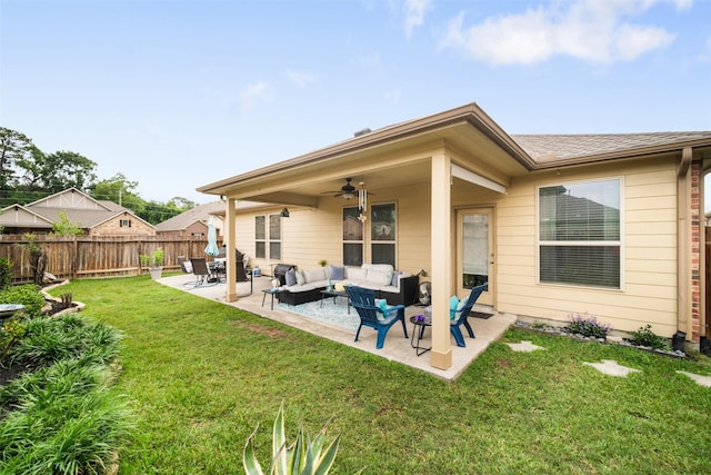 rear view of house with an outdoor living space, ceiling fan, and a patio area