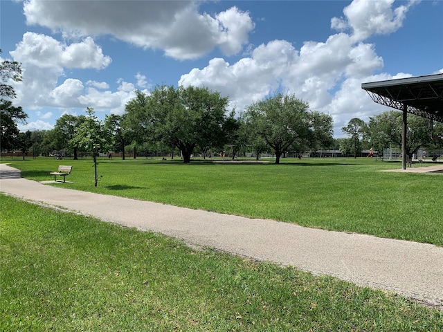 view of property's community with a lawn