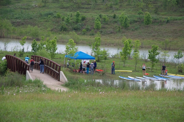 view of community with a water view