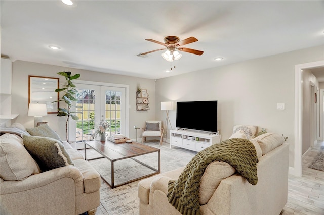 living room featuring french doors, baseboards, ceiling fan, and recessed lighting