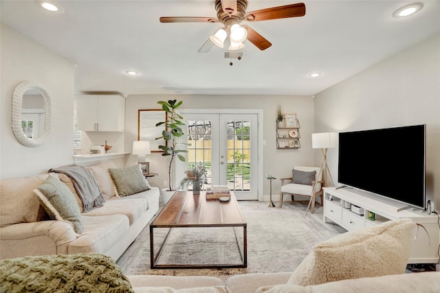 living room with french doors, baseboards, ceiling fan, and recessed lighting