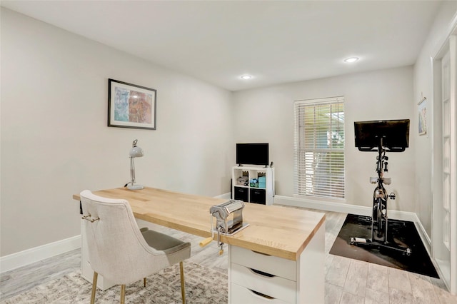 home office featuring baseboards, recessed lighting, and wood finished floors