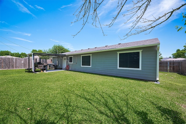 12735 Iroquois St, Houston, TX 77037 - rear view of property with a lawn, a patio area, and a fenced backyard