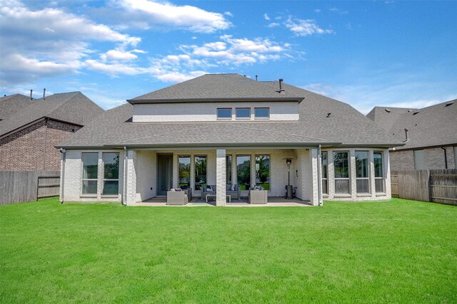 23907 Birchwood Lake Ln, Katy, TX 77493 - back of property featuring an outdoor living space, roof with shingles, and a patio area
