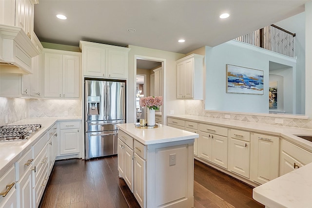 23907 Birchwood Lake Ln, Katy, TX 77493 - kitchen with stainless steel appliances, dark wood-type flooring, light countertops, white cabinets, and recessed lighting