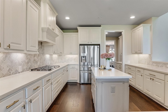 23907 Birchwood Lake Ln, Katy, TX 77493 - kitchen featuring stainless steel appliances, white cabinetry, light countertops, tasteful backsplash, and recessed lighting