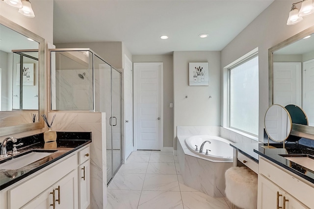 23907 Birchwood Lake Ln, Katy, TX 77493 - bathroom featuring a shower stall, marble finish flooring, a bath, two vanities, and recessed lighting