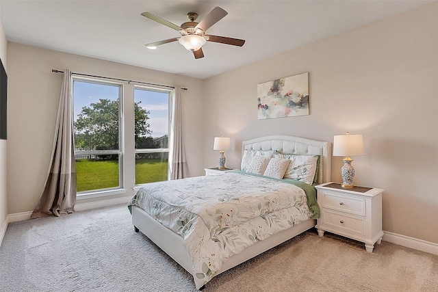 23907 Birchwood Lake Ln, Katy, TX 77493 - bedroom featuring light carpet, baseboards, and ceiling fan