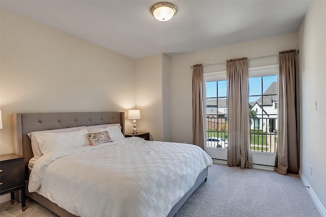 23907 Birchwood Lake Ln, Katy, TX 77493 - bedroom with light colored carpet, access to outside, and baseboards