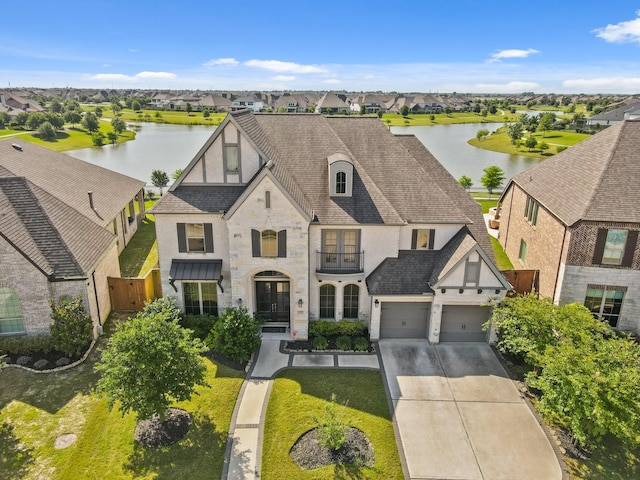 23907 Birchwood Lake Ln, Katy, TX 77493 - view of front of house with driveway, a water view, and a residential view