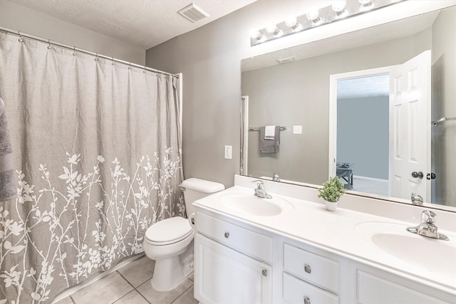 full bath featuring toilet, visible vents, tile patterned flooring, and a sink