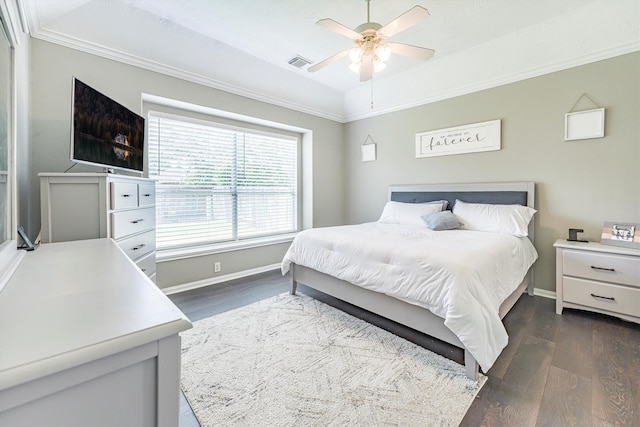 bedroom featuring baseboards, ornamental molding, ceiling fan, visible vents, and dark wood-type flooring