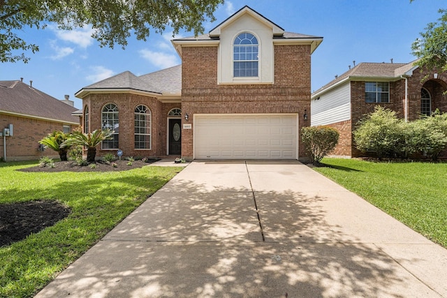 traditional-style house featuring driveway, brick siding, a front lawn, and an attached garage