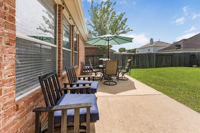 view of patio / terrace with outdoor dining area and a fenced backyard