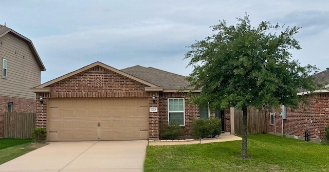 ranch-style home featuring driveway, brick siding, an attached garage, and fence