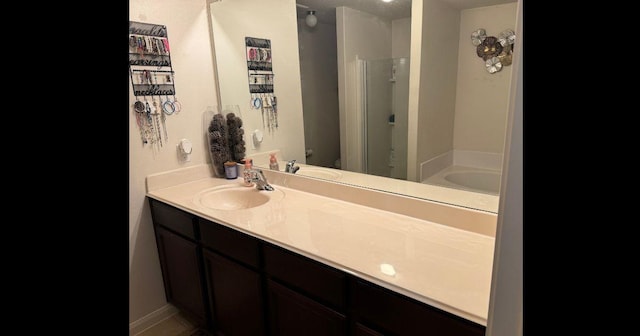 full bathroom featuring walk in shower, toilet, and vanity