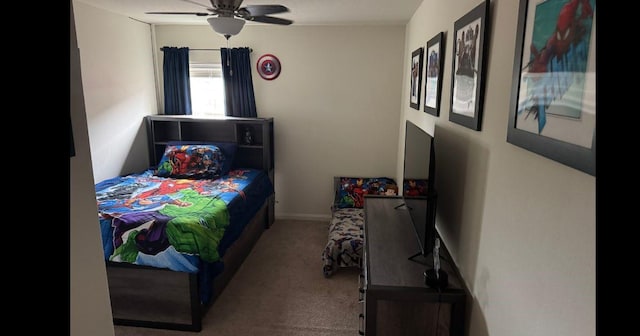 bedroom with a ceiling fan and carpet flooring