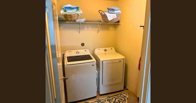 washroom featuring laundry area and washer and dryer