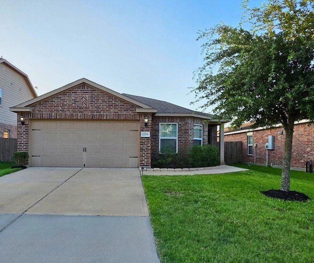 22706 Threefold Ridge Dr, Hockley, TX 77447 - ranch-style home featuring brick siding, driveway, a front lawn, and an attached garage