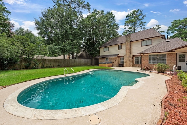 view of swimming pool featuring a yard, a fenced in pool, and a fenced backyard