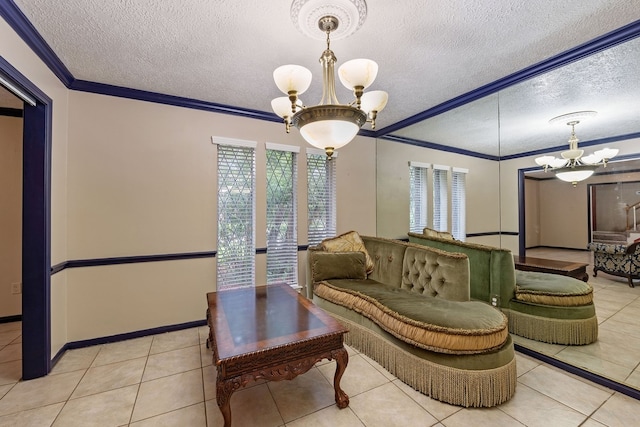 sitting room featuring a textured ceiling, baseboards, ornamental molding, an inviting chandelier, and tile patterned flooring