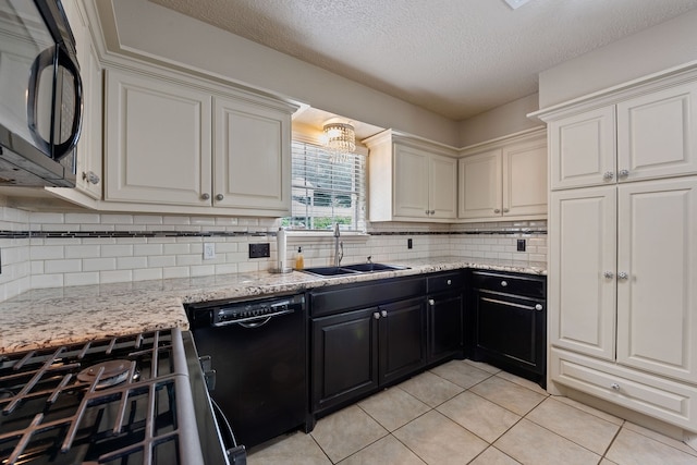 kitchen with a sink, a textured ceiling, black appliances, decorative backsplash, and light tile patterned floors