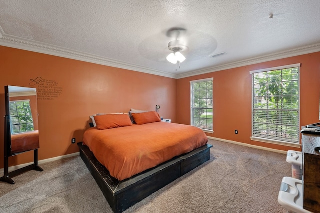 bedroom featuring ornamental molding, carpet floors, and multiple windows