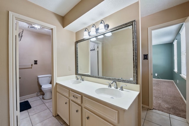 full bathroom with a sink, tile patterned flooring, toilet, and visible vents