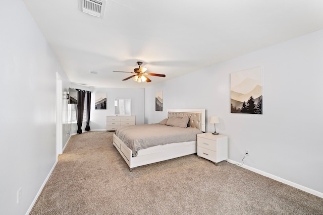 bedroom with ceiling fan, light carpet, baseboards, and visible vents