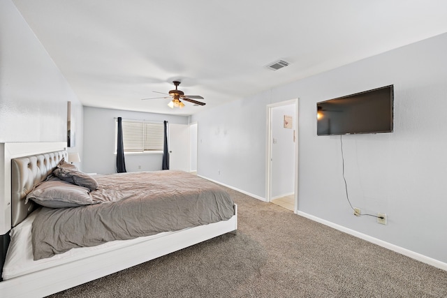 bedroom with baseboards, carpet floors, a ceiling fan, and visible vents