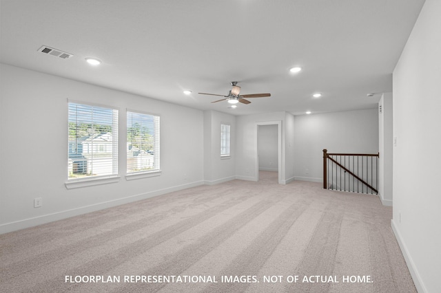 5042 Celestial Ct, La Marque, TX 77563 - spare room featuring light colored carpet, recessed lighting, ceiling fan, and baseboards